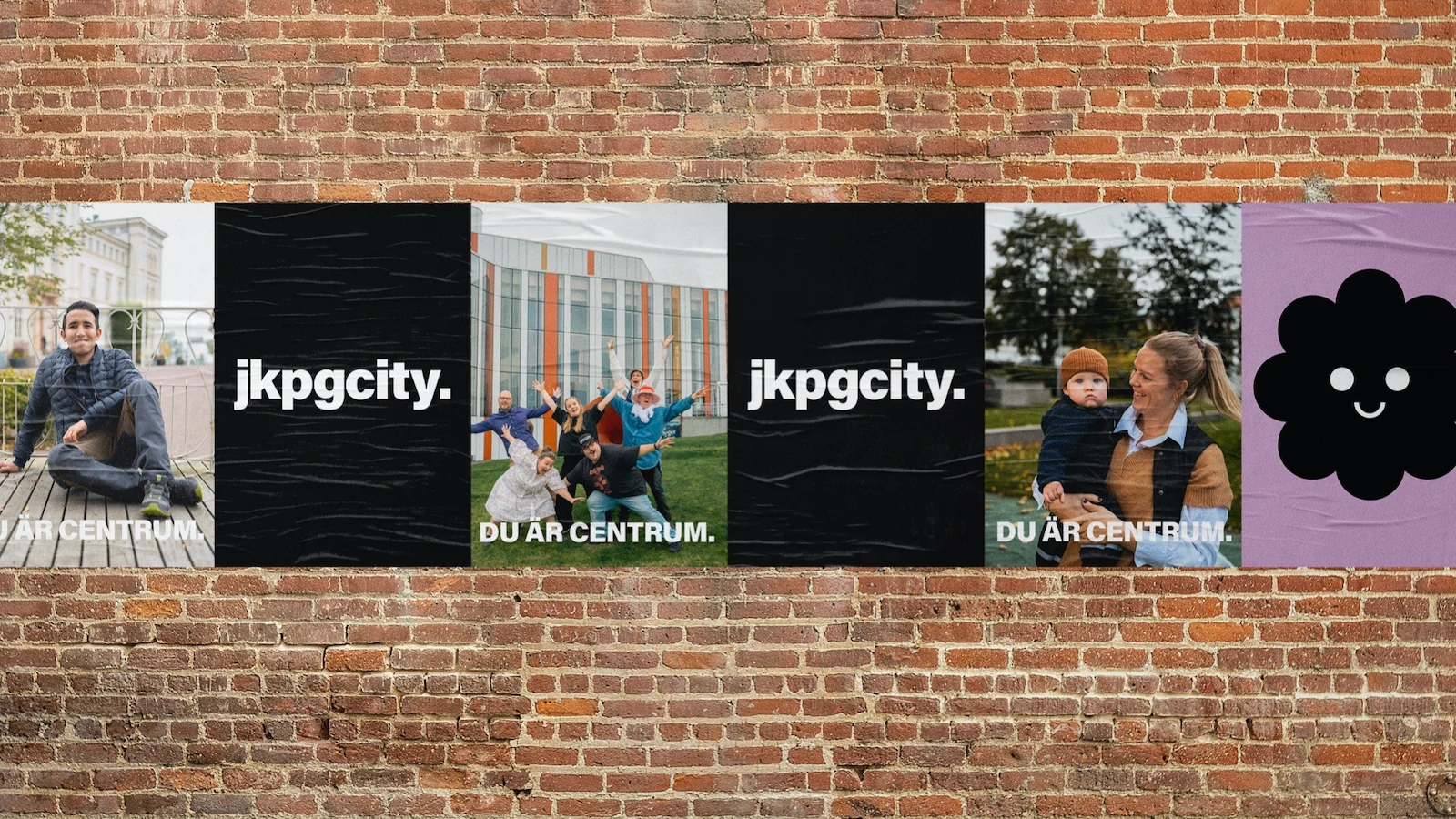 Posters på en tegelvägg med logotyp och stadsmiljöbilder - Ny Studio